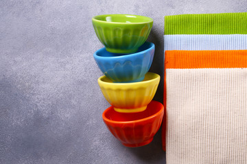 Wall Mural - colored bowls utensils and napkins for food