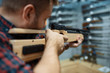 © Nomad_Soul - Male person with pneumatic rifle in gun shop