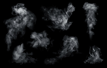 Fog or smoke set isolated on black background. White cloudiness, mist or smog background.