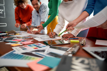 Wall Mural - graphic design team. cropped photo of creative people prototyping new web site design for a client w
