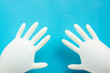 © RomanWhale studio - latex protective gloves on a blue background