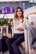 © Yakobchuk Olena - Beautiful lady drinking coffee in airport waiting room