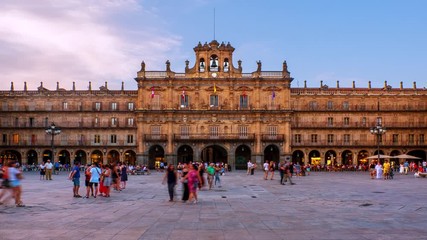 Wall Mural - Salamanca, Spain. Crowded Plaza Mayor in Salamanca, Spain during a sunny evening. Time-lapse of motion blurred people in front of the famous landmark