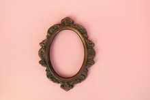 Vintage Round Picture Frame On Pastel Pink Wall.