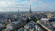 Aerial, tracking, drone shot, of empty streets in Paris and the Eiffel tower, on a sunny day, in France - Coronavirus pandemic