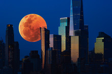 Big Red Full Moon Over The City