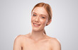 Cheerful ginger woman smiling for camera