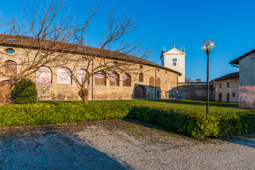 Sunset between the columns. Ancient residence of the Doge of Venice. Udine. Italy