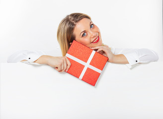 Isolated portrait of a young girl with a gift box in her  hands. Businesswoman with red lips.