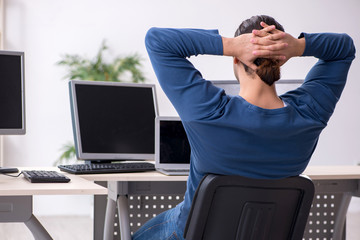 Young male it specialist working in the office