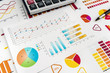 © RomanR - financial charts, work at paper business diagram with pen, at office.