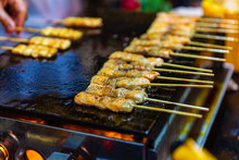 Grilled Salmon Belly Skewers On Flat Top Grill At Street Market, Thailand Street Food