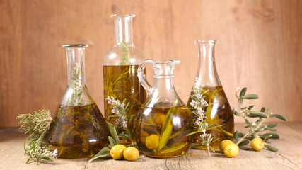 Poster - assorted of olive oil in bottle with branch, rosemary