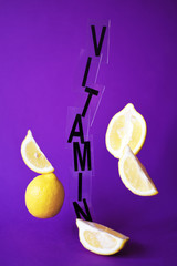 Wall Mural - Lemons levitating in the air on a purple background.