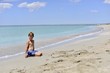 © LKoroleva - A boy sits on a beautiful beach. Copy space for text.