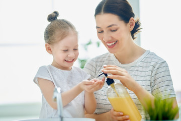 Poster - girl and her mother are washing hands