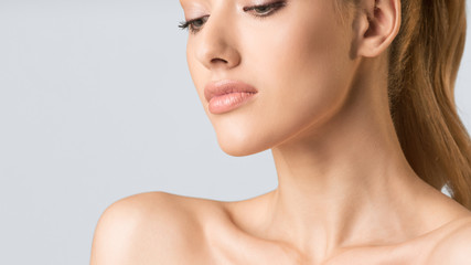 Portrait Of Blonde Girl Posing Over Gray Background, Cropped, Panorama