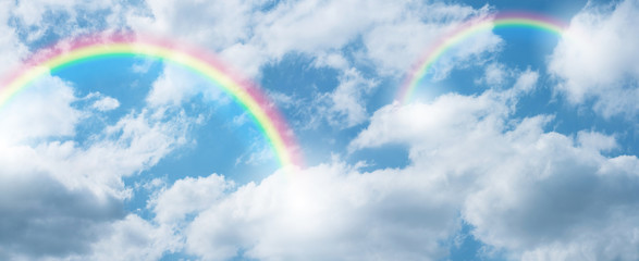Wall Mural - rainbow in blue sky.