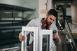 © cherryandbees - Aluminium and PVC industry worker making PVC or aluminium frames for windows and doors