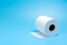 One Toilet Paper Roll Isolated On Blue Background