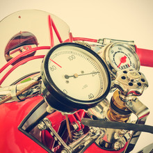 Retro Styled Image Of The Speedometer Of A Restored Red Racing Motorcycle