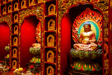 Close-up on a Buddha statue inside the Buddha Tooth Relic Temple in Chinatown District, Singapore.