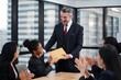 © Asada - Happy CEO and business team congratulating successful African American worker by clapping hands, smiling black employee excited by reward bonus promotion.