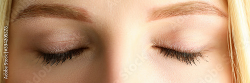 Cuadros en Lienzo Closed eyes of beautiful blonde woman in morning sunshine