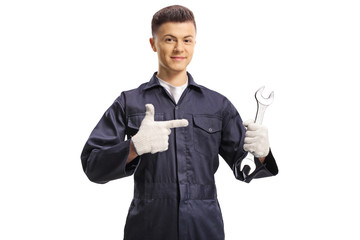Wall Mural - Young guy worker holding a wrench