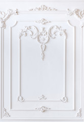 Beautiful white ornament from a decorative stucco molding. Frame molding, copy space, mockup.