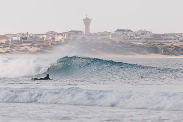 Wall Mural - Longboarder surfing perfect small waves in Peniche 