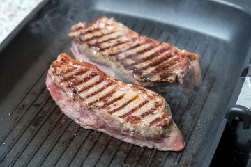 pan-fried beef steak. brown crust on the meat.