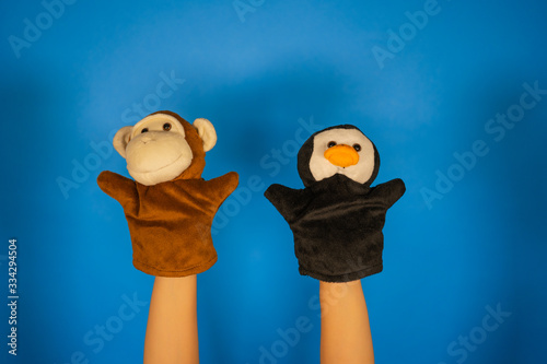 Fotografía Soft puppet toys on hands on blue background