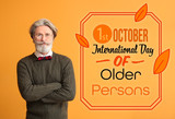 Fototapeta Paryż - Stylish elderly man on color background. International day of older persons