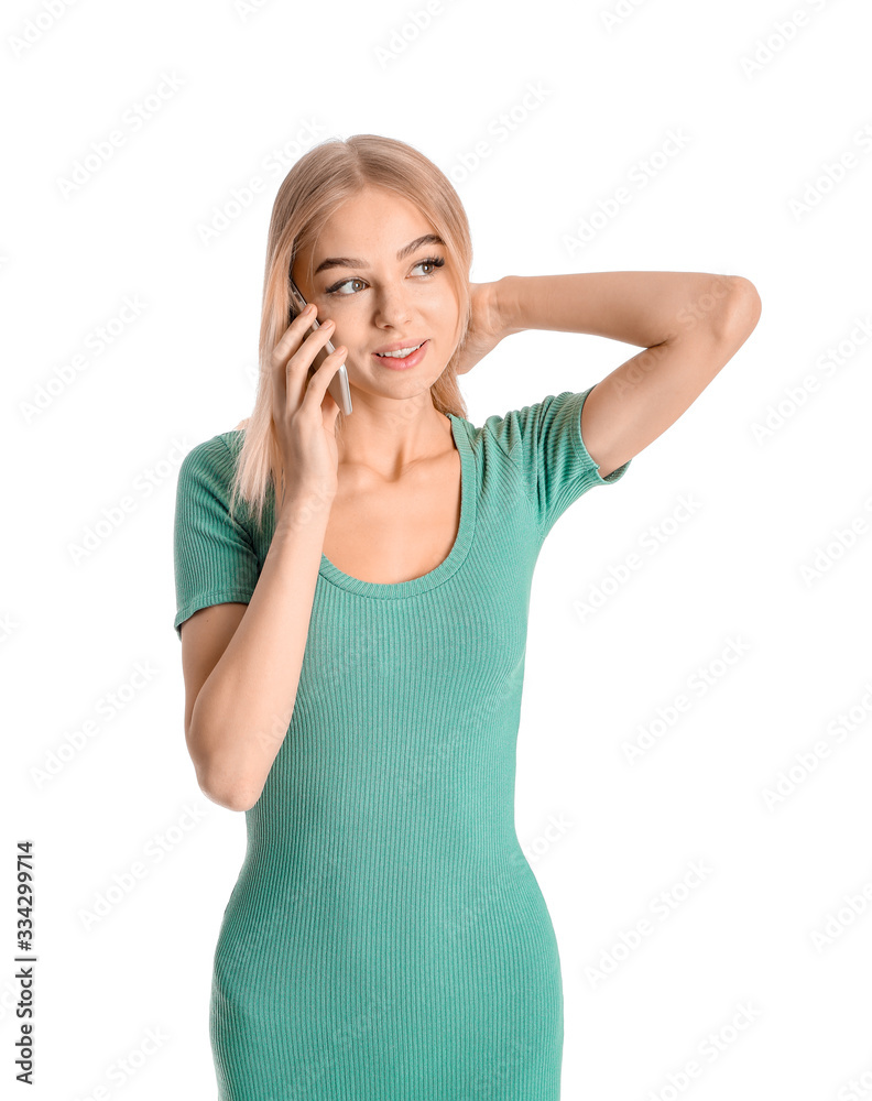 Young woman talking by mobile phone on white background