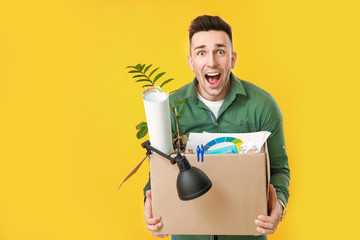 Wall Mural - Happy fired man on color background