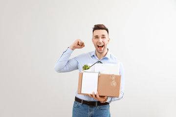 Wall Mural - Happy fired man on light background