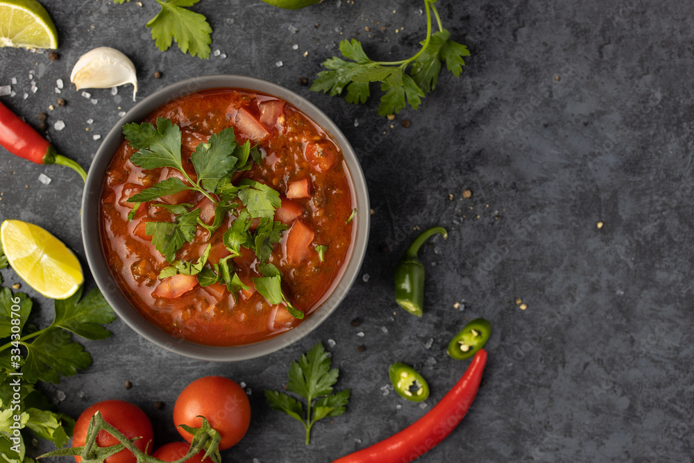 Traditional Latin American mexican salsa sauce and ingredients on stone ...