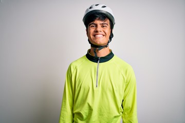 Sticker - Young handsome cyclist man wearing security bike helmet over isolated white background with a happy and cool smile on face. Lucky person.