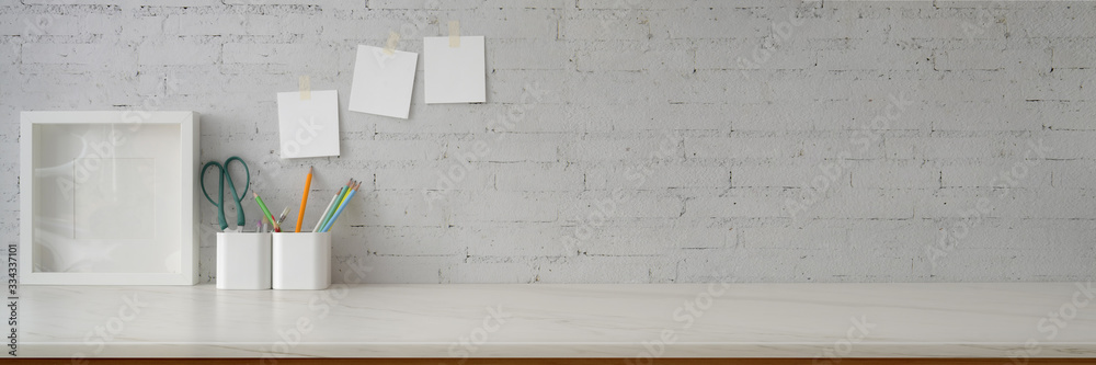 Cropped shot of minimal workspace with mock-up frame, supplies, stationery and copy space - obrazy, fototapety, plakaty 