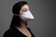 © onderortel - Woman wearing a white mask