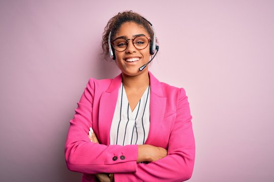 young african american call center agent girl wearing glasses working using headset happy face smili