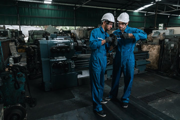 Wall Mural - Industrial engineer men wearing uniform safety in factory working.