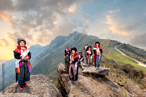 Plakat Yao or Mien hill tribe on Landscapes Sunrise twilight sky over high 103 mountains viewpoint at Banphatang Village ,Wiang Kaen District, Chiang Rai Province , Northwest Thailand..