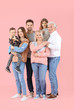 © Pixel-Shot - Portrait of big family on color background