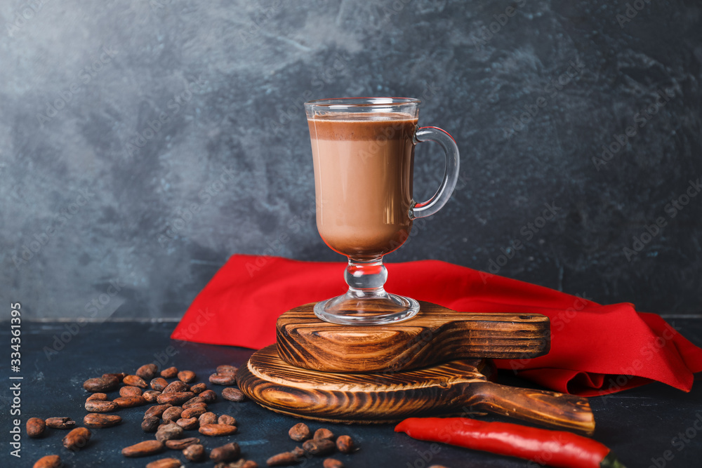 Cup of hot chocolate on dark background