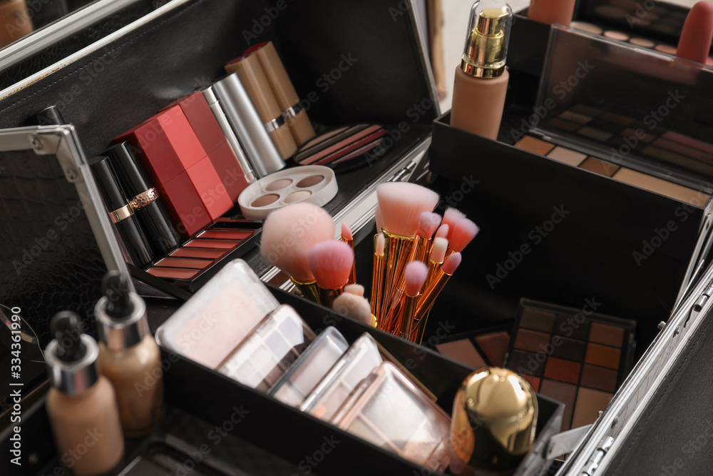 Case of professional makeup artist with decorative cosmetics, closeup