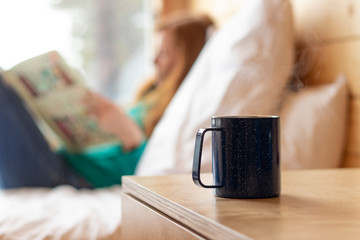 Wall Mural - Closeup of Warm Cup of Tea in Cabin