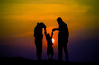© stcom - Happy family, father, mother, son in nature, sunset