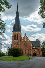 Poster - Beautiful brick church with a tall tower